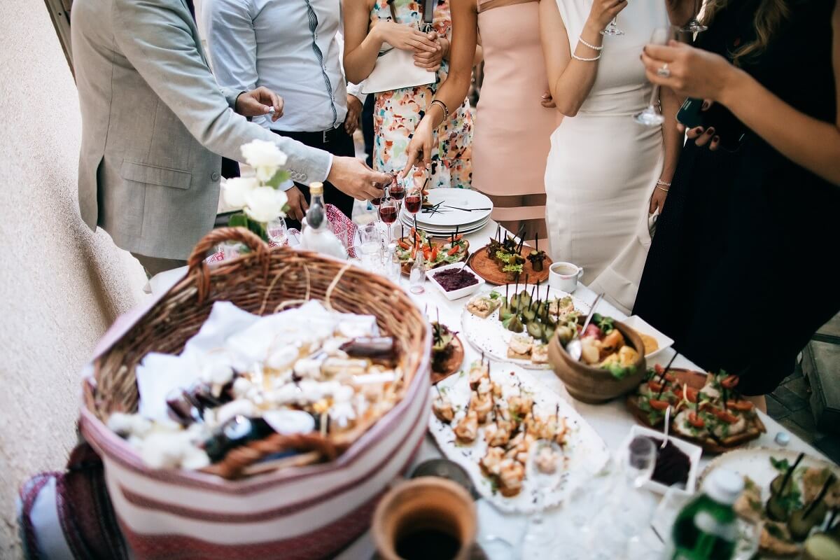 friends eat food at wedding celebration